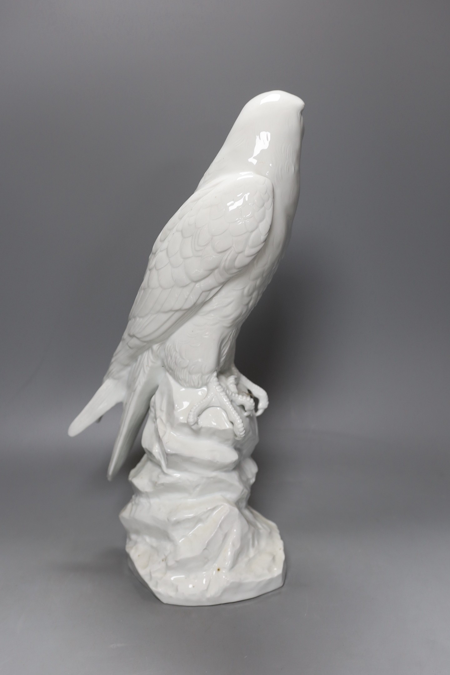 A Dresden white porcelain falcon, 43cm